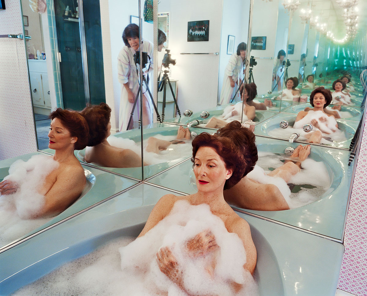 Mother in a bathtub being photographed