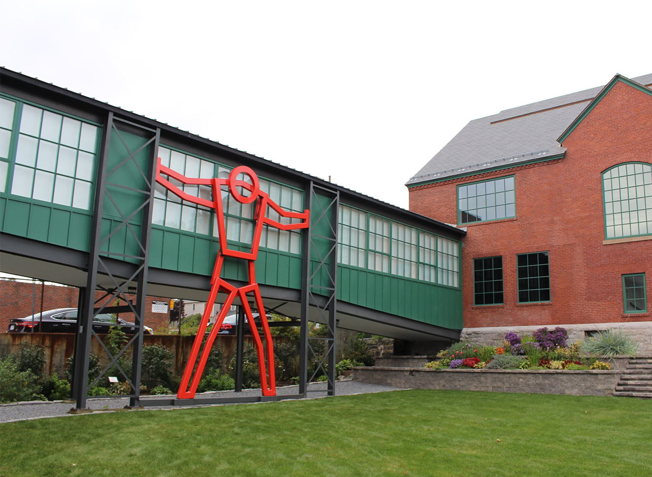 Thurston overlooking Courtyard Fitchburg Art Museum exterior with large red sculpture