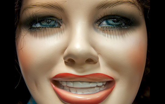 Thumbnail_Past (37) A plastic female manikin head, she has blue eyes with red lipstick and rouge