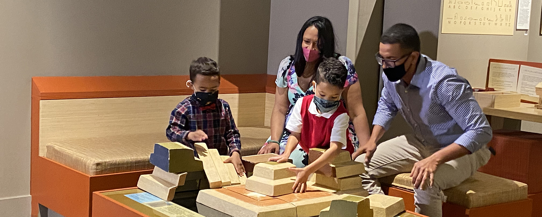 Family Builds Puzzle Pyramid in Discover Ancient Egypt Exhibition